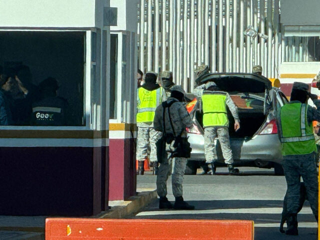 Members of Mexico's National Guard Inspect vehicles. (Credit: Breitbart News Foundati