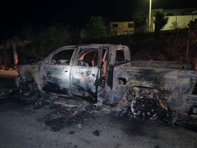 Burned out truck left behind by cartel gunmen.