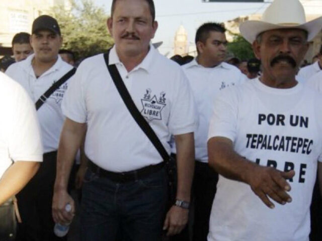 El Tilin (hat) walks with cartel boss El Abuelo. Credit: Breitbart News Foundation / Carte